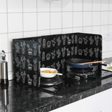 Foldable Splatter Shield standing on a stovetop