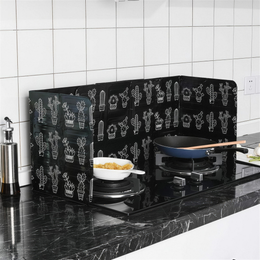 Foldable Splatter Shield standing on a stovetop